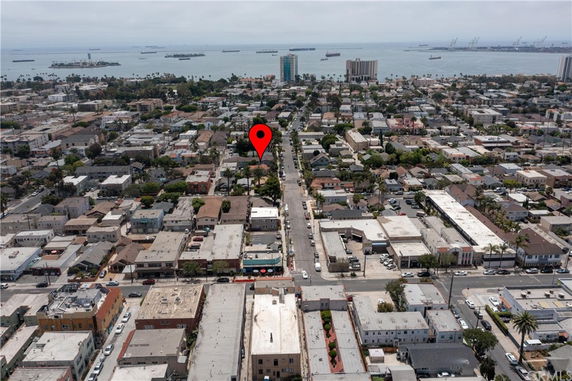 Panoramic view of a coastal urban neighborhood with ocean in the background.