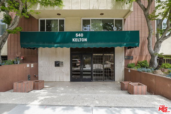 Front view of a building entrance with awning labeled '540 Kelton'.
