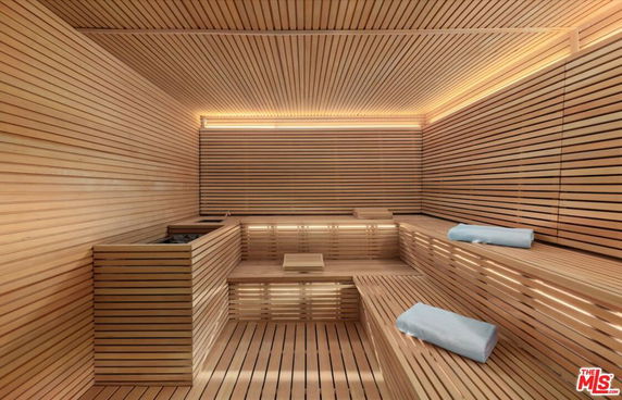 Interior view of a modern sauna with wooden benches and walls.