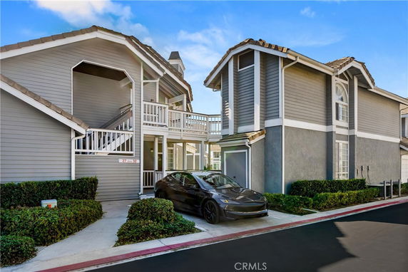 Front view of a two-story house with a modern design and attached garage.