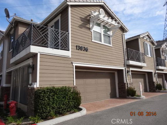 Front view of a two-story house with a double garage.