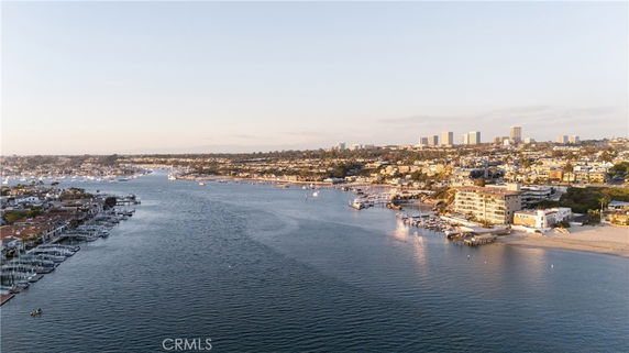 Panoramic view of a coastal area with buildings and docks along the shoreline.
