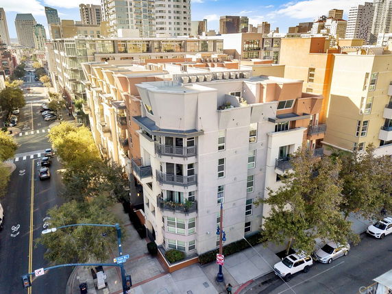 Front view of a modern multi-story apartment building in an urban area.