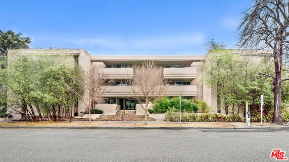 Front view of a multi-story building with a modern design.
