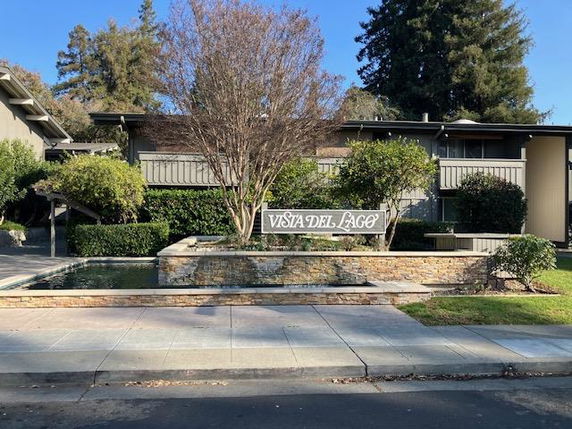 Front view of a residential building with a sign 'Vista Del Lago'.