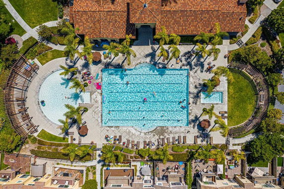 Aerial view of a swimming pool area with surrounding amenities.