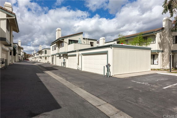 Front view of residential buildings with attached garages.