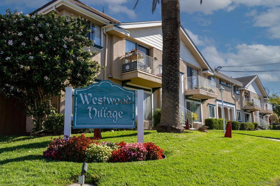 Front view of a multi-story residential building at Westwood Village.