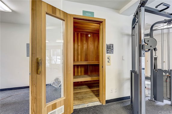 Interior view of a gym area with a sauna.