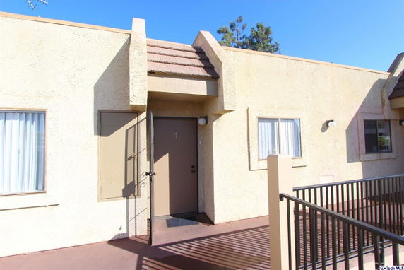 Front view of a single-story apartment with a small entrance area.