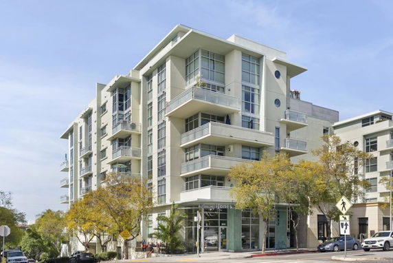 Front view of a modern multi-story apartment building.