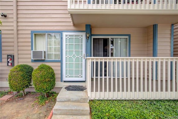 Front view of a house with a small balcony and a security door.