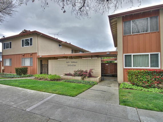 Front view of a multi-story building labeled 'San Tomas Estates'.