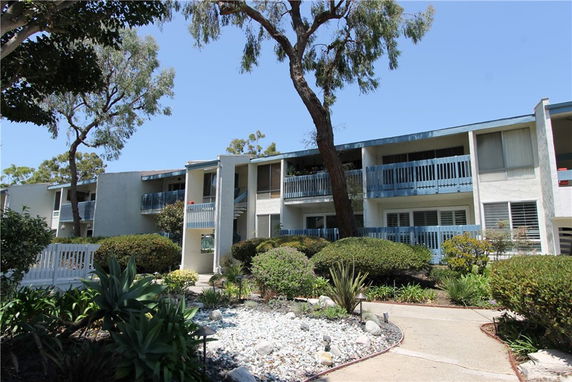 Front view of a two-story residential building with balconies.