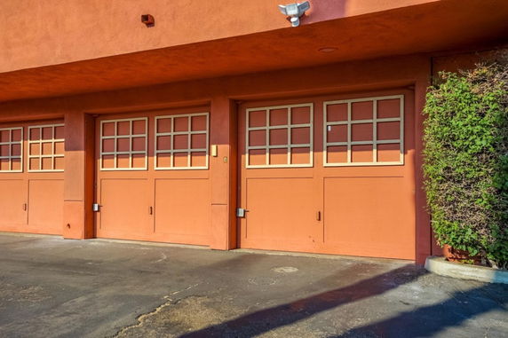 Front view of a building with three garage doors.