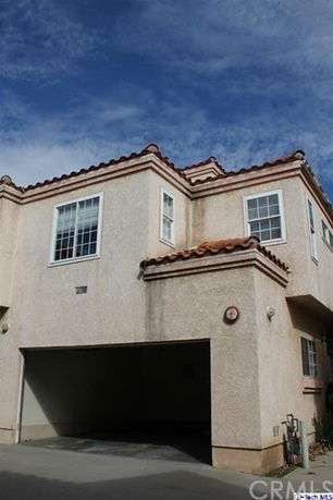 Front view of a two-story house with a double garage.