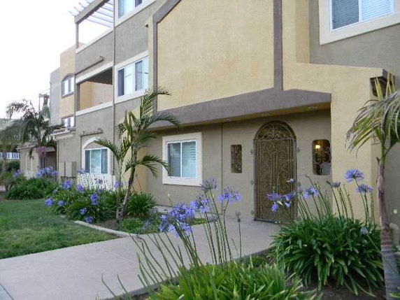 Front view of a multi-story building with decorative entryway.