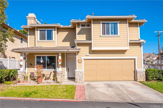 Front view of a two-story house with a double garage
