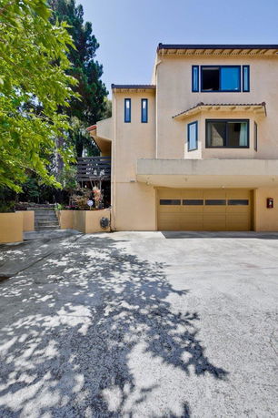 Front view of a two-story house with a garage.