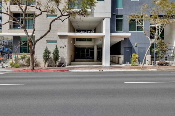 Front view of a multi-story building with a modern entrance.