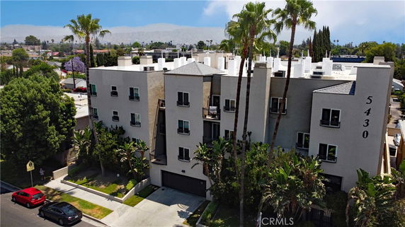 Front view of a multi-story residential building with a number 5430 on the facade.