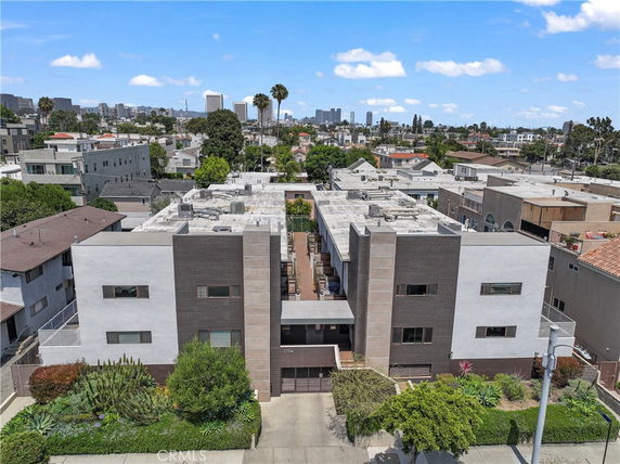 Front view of a modern multi-story building with a flat roof.