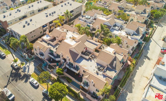Aerial view of a residential neighborhood with multiple houses and buildings.