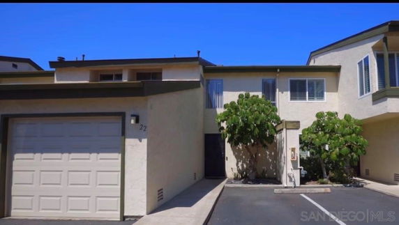 Front view of a two-story house with a garage.