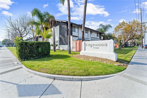 Front view of a residential building with a sign labeled 'Edgewood 7100'.