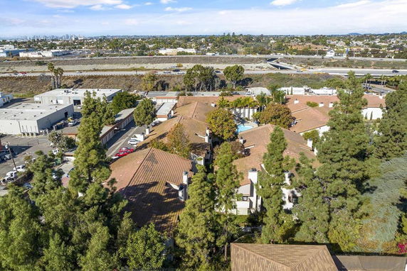Aerial view showing a complex with multiple buildings and surrounding roads.