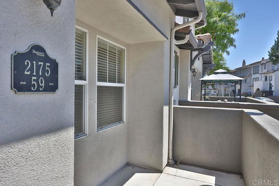 Exterior view of a residential area with a focus on house number 2175-59.