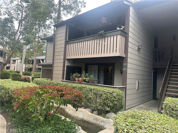 Front view of a two-story residential building with balconies.