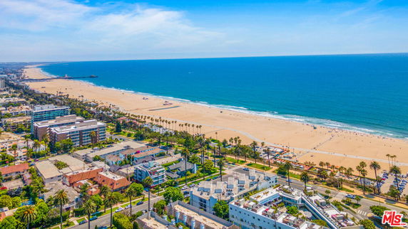 Panoramic view of a coastal area with a beach and ocean.