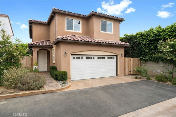 Front view of a two-story house with a double garage.