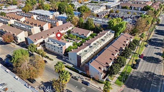 Aerial view of a residential complex with multiple buildings in an urban area.
