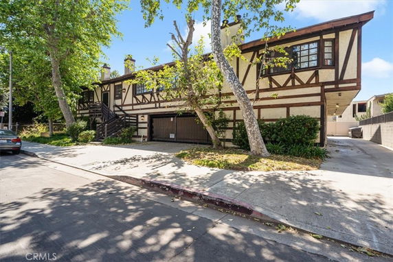 Front view of a two-story house with wooden accents.