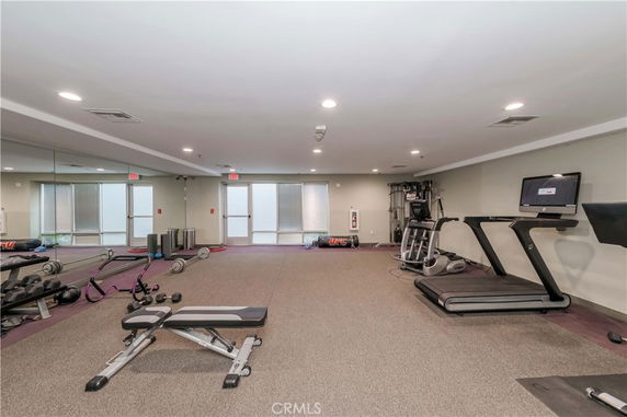 Indoor gym area with various exercise equipment.