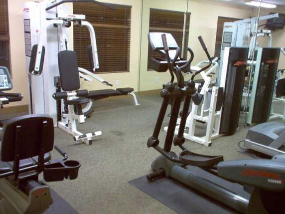 Indoor gym area with exercise equipment.