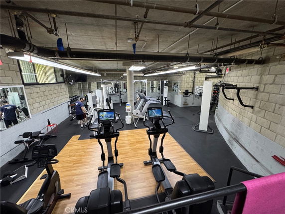 Indoor gym area with exercise equipment.