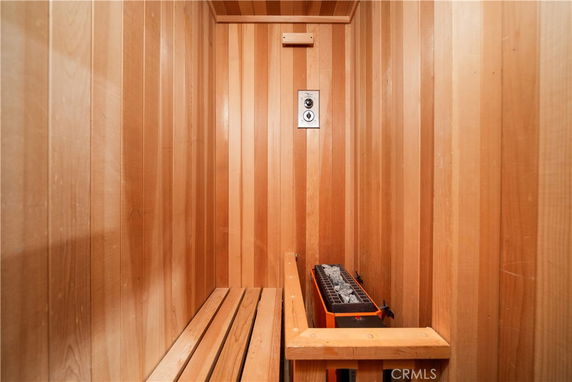 Interior of a wooden sauna room with heating stones.