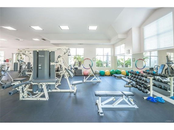 Interior view of a gym with various exercise equipment.