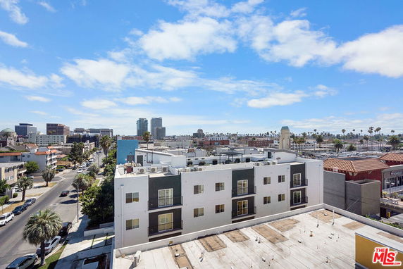 Wide angle view of cityscape with buildings and streets.