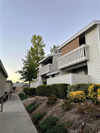 Front view of a two-story residential building with balconies.
