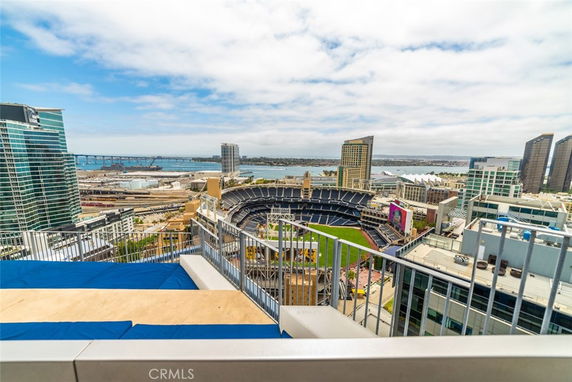 Panoramic view overlooking a stadium and cityscape from a high vantage point.