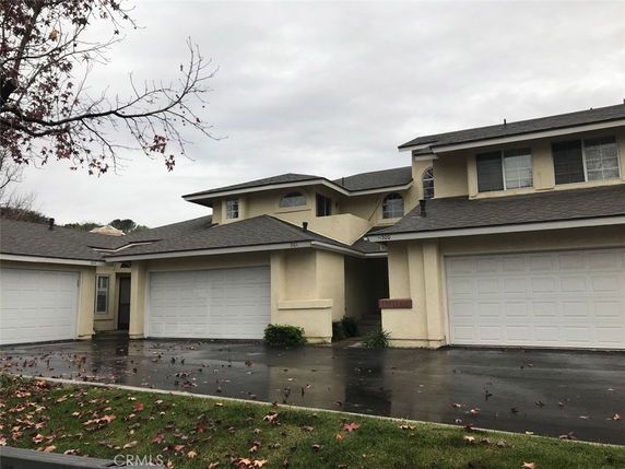 Front view of a two-story house with a double garage.