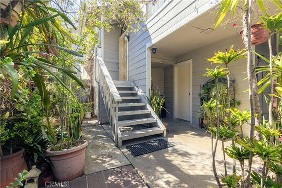 Entrance area with stairs leading to the upper level of a house.