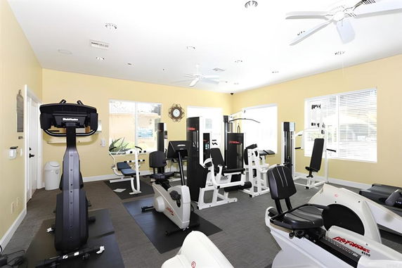 Interior of a fitness room with exercise equipment.