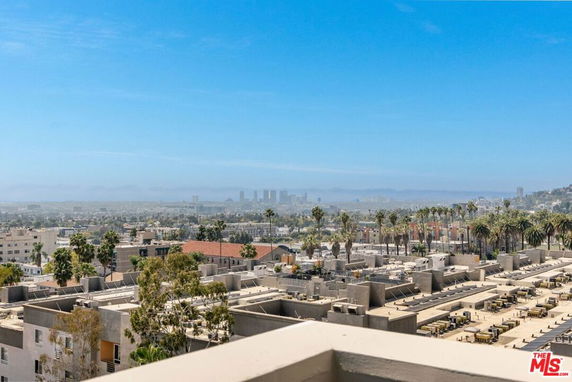 Panoramic view of cityscape with buildings and skyline in the distance.