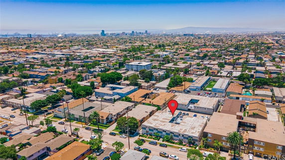 Wide view of a cityscape with residential buildings and distant skyline.