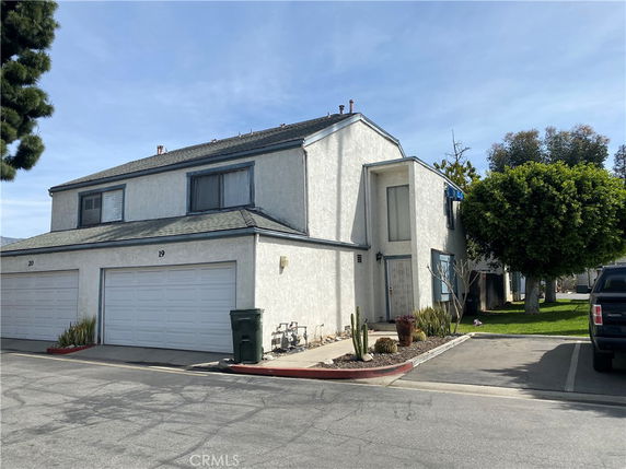 Front view of a two-story house with a double garage